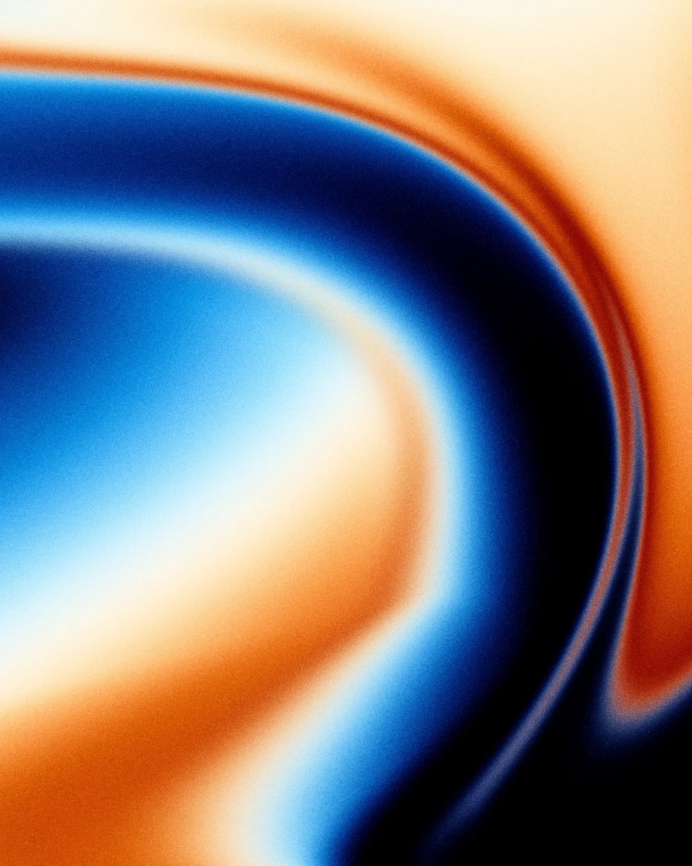 Grainy abstract gradient: a deep blue current curling through molten orange and cream light over a black field